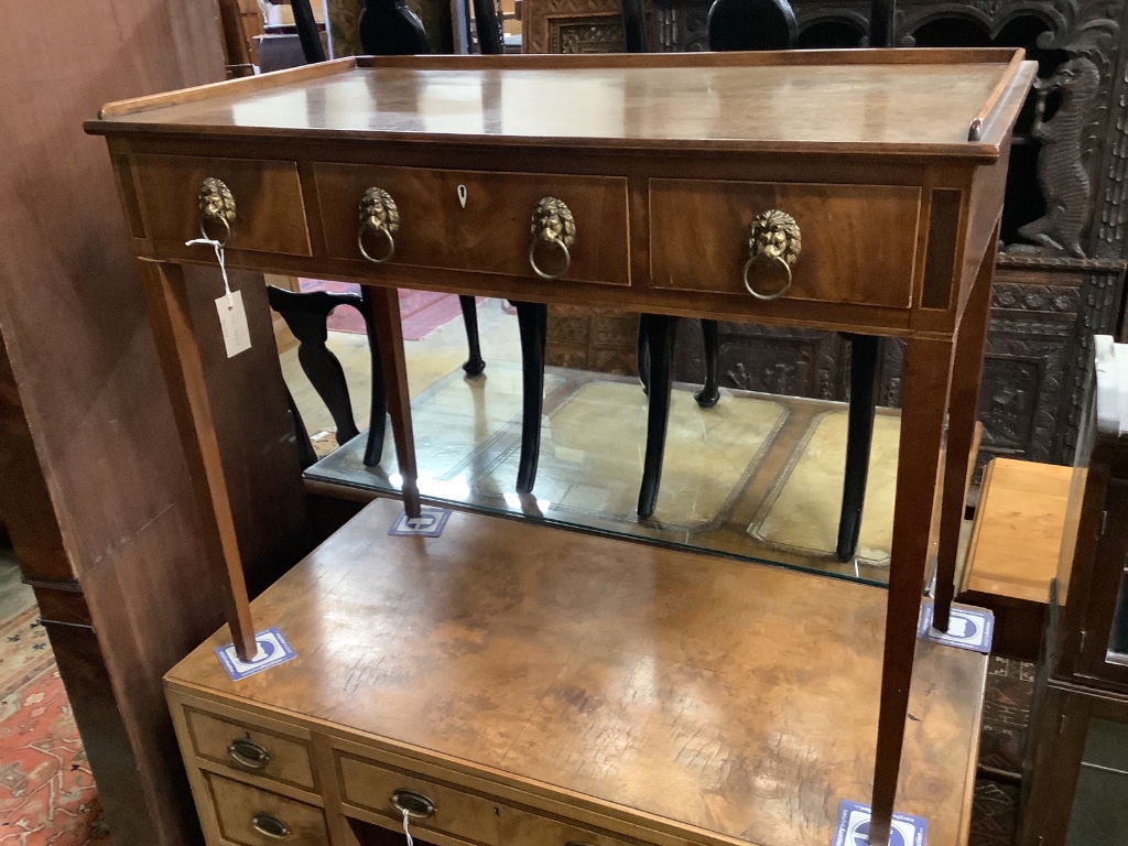 A George III mahogany side table, having three-quarter galleried top over three short drawers on tapered legs, width 95cm depth 51cm height 77cm